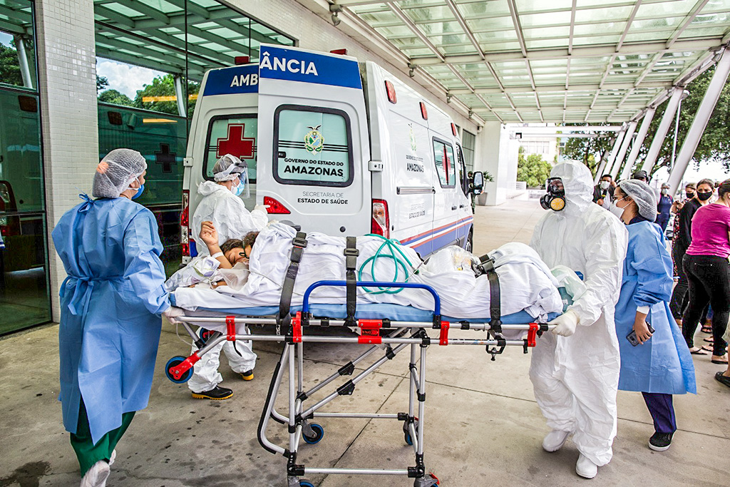 A patient arrives at the 28 de Agosto Hospital in Manaus, Amazon State, Brazil, on January 14, 2021, amid the novel coronavirus, COVID-19, pandemic. - Manaus is facing a shortage of oxygen supplies and bed space as the city has been overrun by a second surge in COVID-19 cases and deaths. (Photo by Michael DANTAS / AFP) (Photo by MICHAEL DANTAS/AFP via Getty Images)