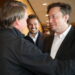 Brazil's President Jair Bolsonaro and Tesla CEO Elon Musk talk during a meeting in Porto Feliz city in Sao Paulo state, Brazil May 20, 2022.  Kenny Oliveira/MCom/Handout via REUTERS